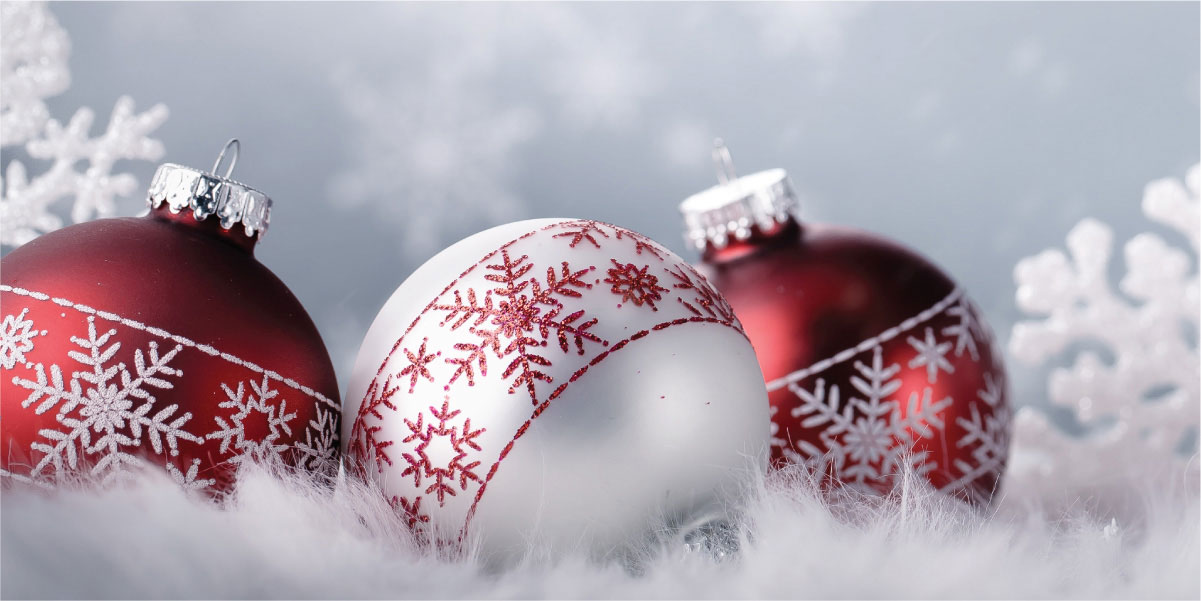 Red and White Christmas Ornaments in snowy setting