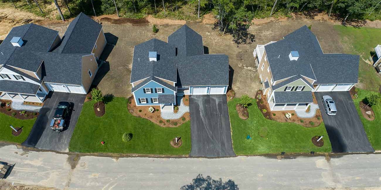 Aerial view of two recently built homes in Redbrook